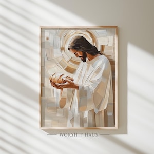 May include: A framed print depicts a figure in white robes holding bread, with a halo effect behind the head. The artwork has a warm color palette of beige, brown, and white. The text "WORSHIP HAUS" is at the bottom of the frame.