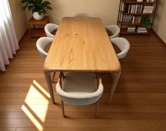 May include: A light-colored wooden dining table with rounded edges, surrounded by six upholstered chairs. The table is approximately 72 inches long. The room features hardwood flooring, a bookshelf, and a potted plant.