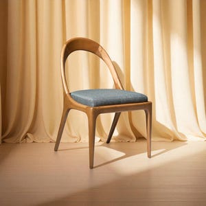 Wood dining chair with comfortable seat, modern kitchen and home decor accent, sustainable oak and rattan design for dining table