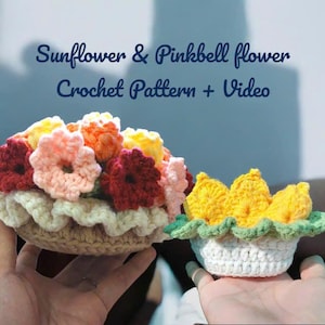May include: Crocheted flower arrangements in a basket and a small pot. The flowers are in shades of yellow, orange, pink, and red. The text on the image reads "Sunflower & Pinkbell flower Crochet Pattern + Video."