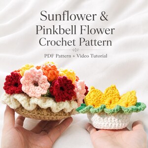 May include: A crochet pattern titled Sunflower & Pinkbell Flower Crochet Pattern PDF Pattern + Video Tutorial featuring two crocheted flower arrangements, one with red, pink, and yellow flowers in a tan base, and one with yellow flowers in a white base.