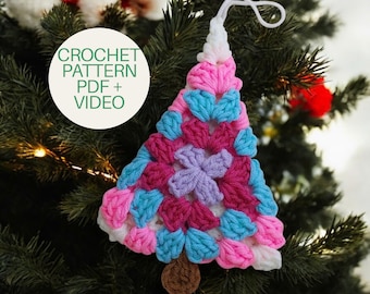 May include: A triangular crochet ornament shaped like a tree, featuring a colorful granny square pattern in shades of pink, blue, purple, and white, with a brown base and a white hanging loop. The text CROCHET PATTERN PDF + VIDEO is visible.