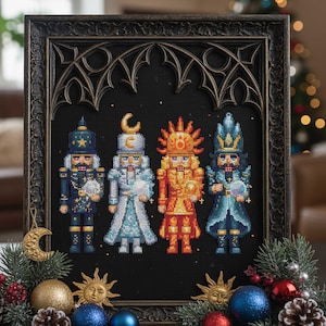May include: Framed cross-stitch art featuring four colorful nutcracker figures. The nutcrackers are in shades of blue, gold, and red, set against a black background. The frame is dark brown with an ornate design. Decorative elements include ornaments and pine.