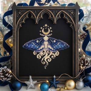 May include: A framed cross-stitch featuring a celestial moth with a crescent moon and star design. The moth has blue wings with white dots, set against a black background. The frame is dark brown with an arched top, decorated with holiday ornaments.