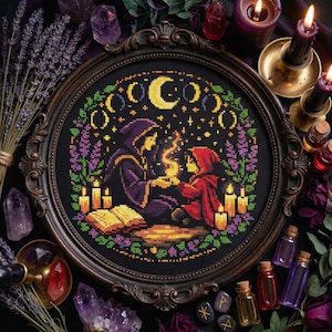 May include: A framed cross-stitch featuring two robed figures, lit by candles, set against a starry night sky with crescent moons. The dark brown frame surrounds the mystical scene. The overall theme is magical.