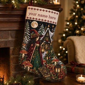 May include: A Christmas stocking featuring a cross-stitch design of a figure in a red hat and green dress holding a lantern, surrounded by mushrooms, a house, and gifts. The top cuff is cream-colored with the text your name here in red.