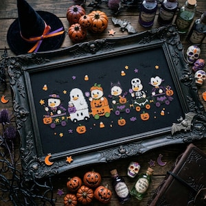 May include: A black framed cross-stitch embroidery featuring six cartoon characters in Halloween costumes, including a ghost, a pumpkin, and a skeleton, arranged on a black background with small orange pumpkins and stars.