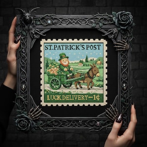 May include: Cross-stitch art piece featuring a postage stamp design with a leprechaun driving a cart pulled by a donkey. The stamp reads "ST. PATRICK'S POST" and "LUCK DELIVERY - 1¢". The frame is dark gray with decorative elements.