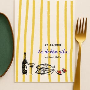 May include: A cream-colored card with yellow vertical stripes features a black and white illustration of a wine bottle, glass, fish, and figs. The text "08.14.2026" and "la dolce vita" are also present. A gold fork and green plate are on the sides.