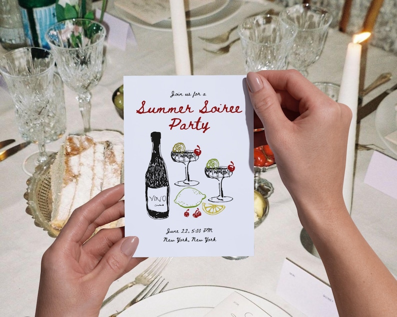 May include: A white invitation card with the text "Join us for a Summer Soiree Party" in red and black. The card features illustrations of a wine bottle, cocktails, and fruit. The event details include the date, time, and location: June 22, 5:00 PM, New York, New York.
