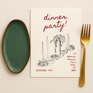 May include: A green oval-shaped ceramic plate with a brown rim, a gold fork, and a cream-colored invitation with the words "dinner party!" in red script. The invitation includes a black and white illustration of a table setting with candles.