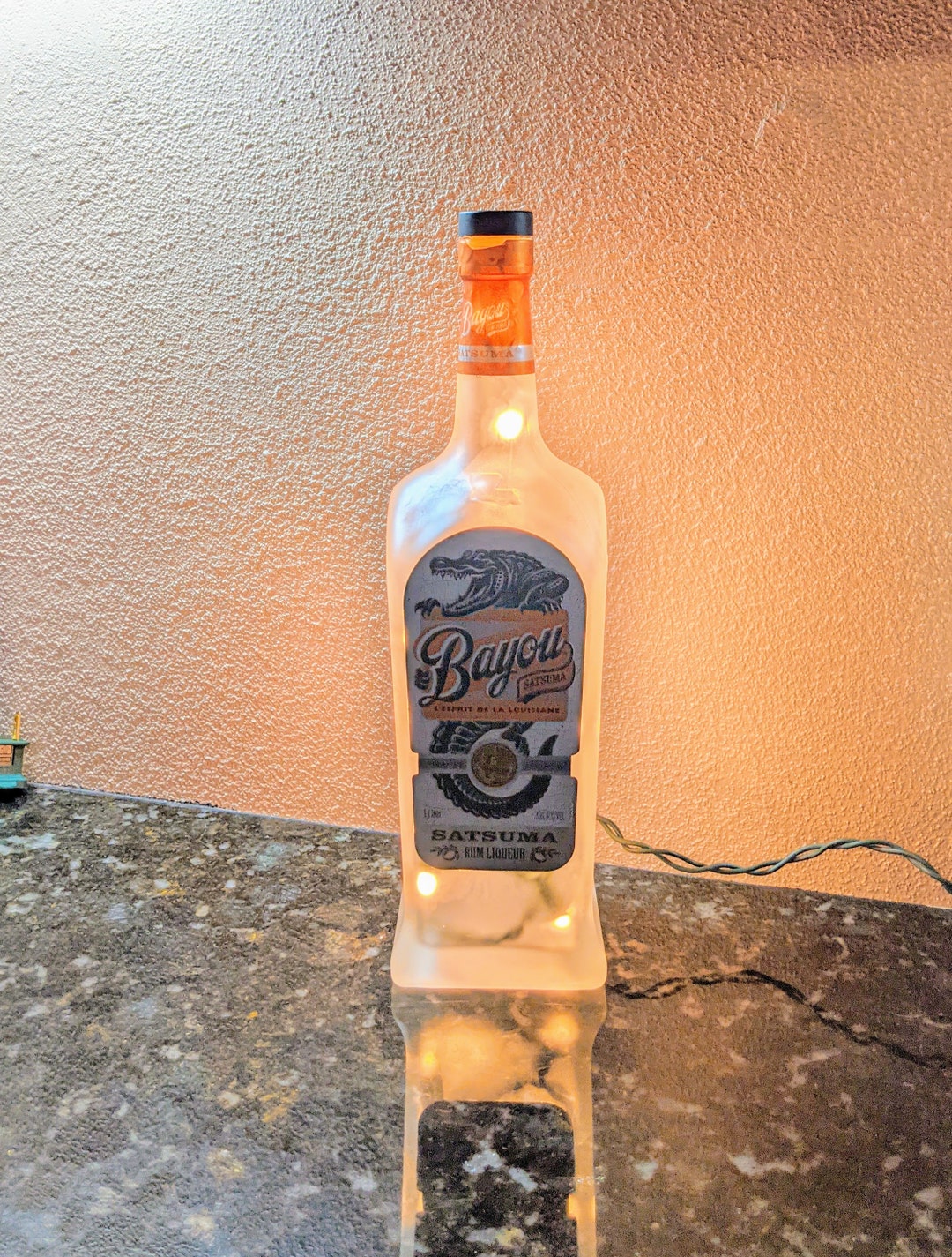 Bayou Satsuma Rum Liqueur With Alligator Label Liquor Bottle Light