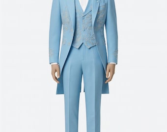 May include: A light blue formal suit with a long tailcoat, vest, and trousers. The suit features silver embroidery and is paired with a white dress shirt, bow tie, and white shoes. A white flower is pinned to the lapel.