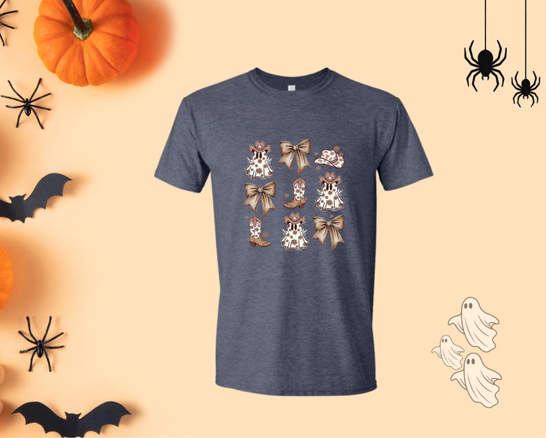 May include: A navy blue t-shirt featuring a repeating pattern of white and brown bows, cowboy boots, and hats. The design has a Halloween theme, with a pumpkin, spiders, bats, and ghosts in the background.