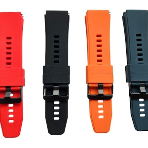 May include: Four silicone watch straps in red, black, orange, and teal. Each strap has a black metal buckle and adjustment holes. The straps are designed for a comfortable and secure fit.