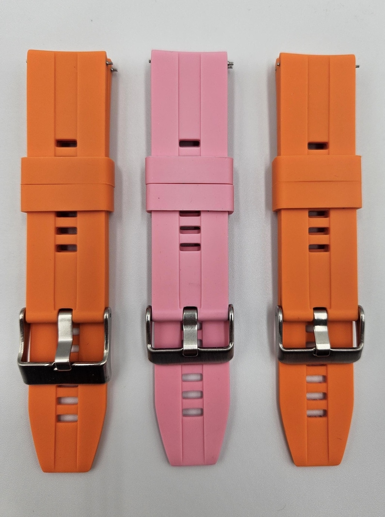 Silicone watch straps in light pink (baby pink) and bright orange – soft, durable, unisex quick release replacement bands.