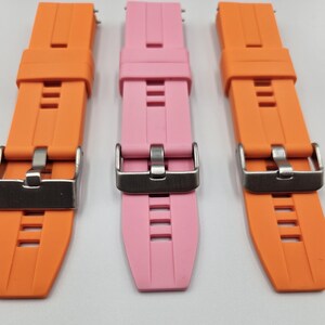 Silicone watch straps in light pink (baby pink) and bright orange – soft, durable, unisex quick release replacement bands.