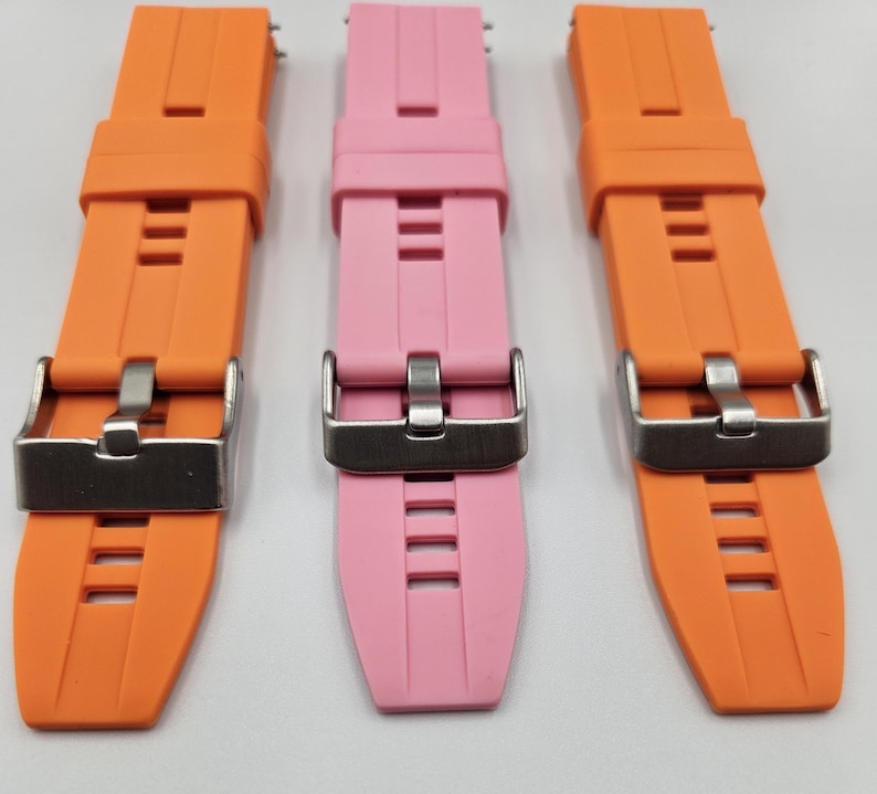 Silicone watch straps in light pink (baby pink) and bright orange – soft, durable, unisex quick release replacement bands.