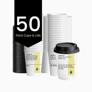 May include: A stack of white paper coffee cups with black lids. The image shows a pack of 50 cups and lids. The cups have Bible verses printed on them. The cups are for hot beverages.