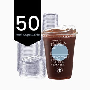 May include: A clear plastic cup filled with a dark liquid, topped with a clear lid. The cup has text that reads "2 Corinthians 12:9 MY GRACE IS SUFFICIENT FOR FOR MY POWER IS MADE PERFECT IN WEAKNESS." A stack of clear cups and lids are in the background. The image also shows the text "50 Pack Cups & Lids."