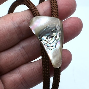 Vintage abalone bolo tie with brown cords