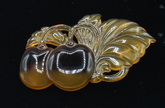 Bakelite Brooch Translucent amber cherries Figura… - image 2