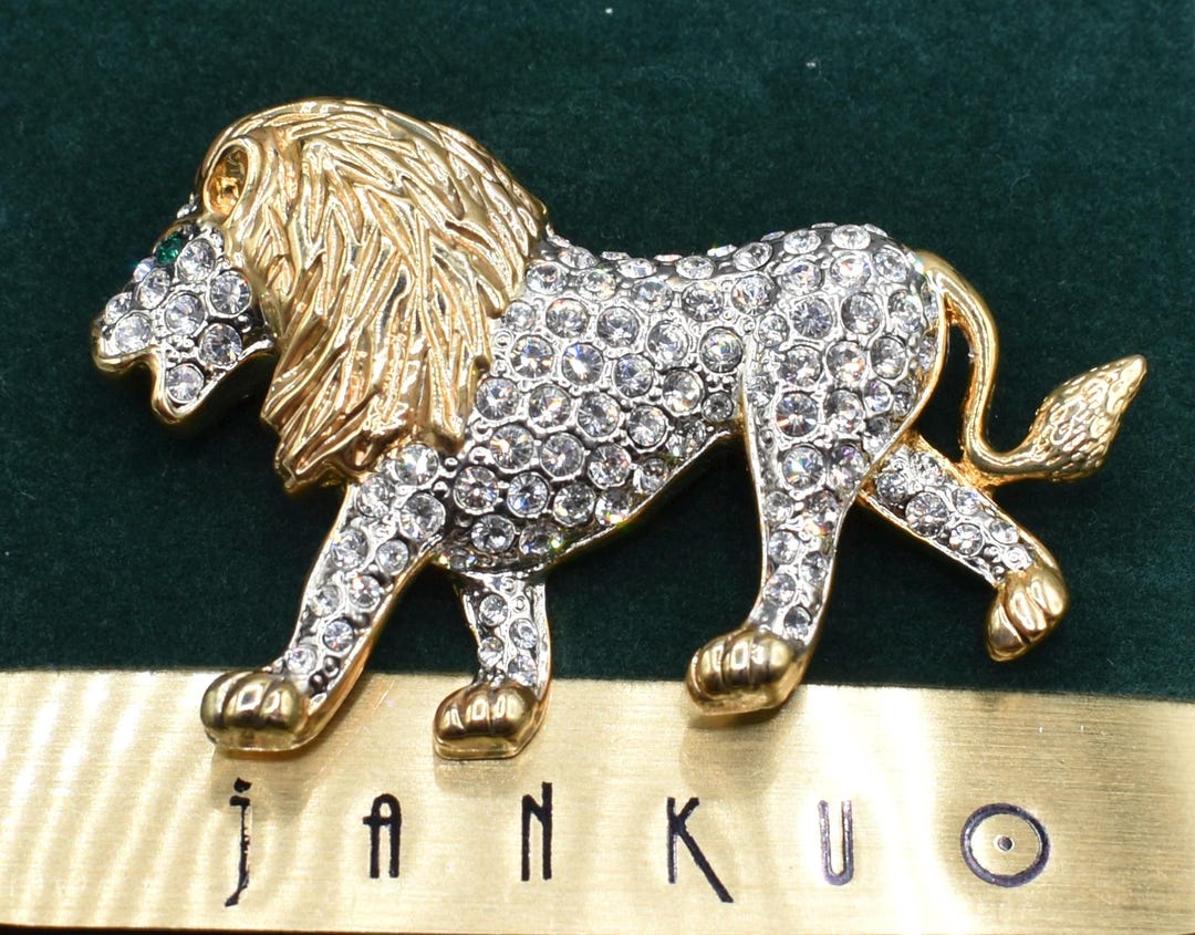 Signed JANKUO Rhinestone Lion Brooch Gold Tone Green Eyes on