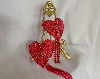Corazones de cristal rojo con borlas removibles de cristal rojo