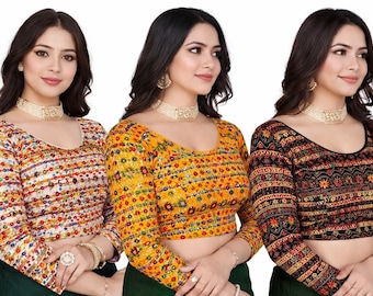 May include: Three long-sleeved blouses with intricate embroidery. The blouses feature a variety of colors, including orange, yellow, and black, with detailed patterns. The blouses have a scoop neckline and are likely part of a traditional or ethnic clothing collection.