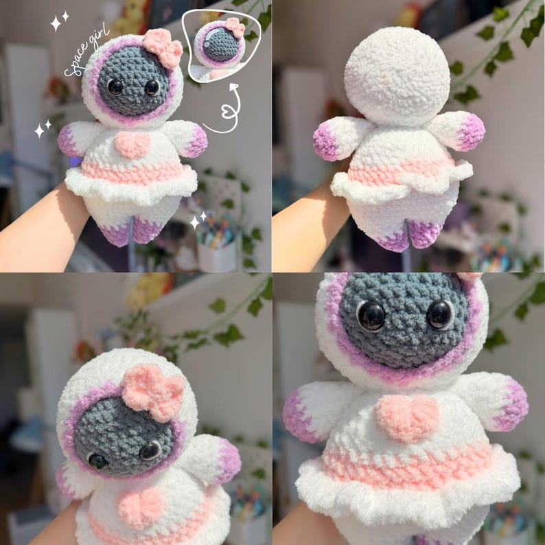 Op de afbeelding: Gehaakte pop in een ruimtepak-ontwerp. De pop heeft een grijze kop, een witte body en roze en paarse accenten. De pop draagt een wit ruimtepak met een roze hart en een roze strik. De tekst "space girl" is zichtbaar.