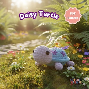 May include: A crocheted turtle with a light purple head and a blue shell adorned with purple flower accents. The text "Daisy Turtle" is above the turtle, and a "PDF Pattern" badge is visible. The turtle is set in a garden.