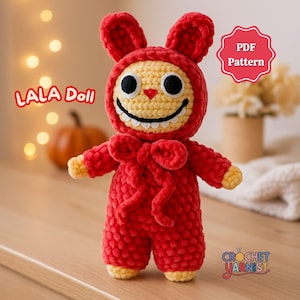 May include: A handmade red crochet doll with a bunny hood, large black eyes, and a wide smile. The doll has yellow accents on the face, hands, and feet. The text "LALA Doll" is displayed on the left, and "PDF Pattern" is on the right.