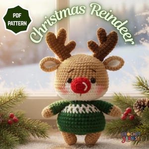 May include: A crocheted reindeer toy with brown antlers, a red nose, and a green sweater. The text "Christmas Reindeer" is arched above the reindeer. A green and white "PDF PATTERN" badge is in the upper left corner. The text "CROCHET YARNIST" is in the lower right corner.