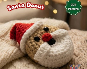 May include: A crochet Santa donut featuring a tan face, a red hat with a white brim, a white beard, a red nose, and black eyes. The text Santa Donut and PDF Pattern are visible. The item is crafted from yarn with a textured, looped appearance.