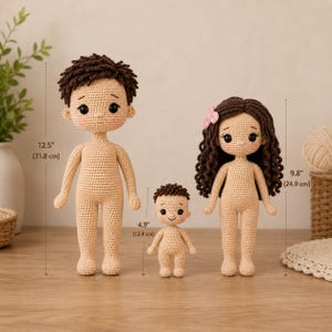 May include: Three crocheted dolls with beige skin, black eyes, and pink cheeks. The tallest doll has short brown hair and measures 12.5 inches. The medium doll has long curly brown hair with a pink flower and measures 9.8 inches. The smallest doll has short brown hair and measures 4.9 inches.