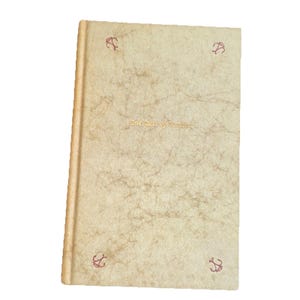 May include: A vintage book with a textured, off-white cover. The title "The Rise of Something" is printed in gold script. Red anchor motifs are in each corner. The spine is a light tan color.