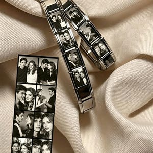 May include: Two silver-toned modular link bracelets featuring rectangular panels with black and white photographic portraits of couples. A vertical rectangular print displays a grid of eight black and white photographs of the same couples.