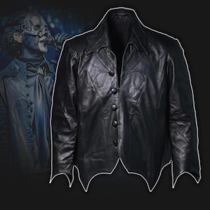 May include: A black leather jacket with a unique batwing-shaped hemline and collar. The jacket features a button-up front and decorative stitching. The design is reminiscent of gothic or alternative fashion.