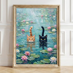 May include: A framed painting depicting an orange tabby cat and a black cat swimming in a pond filled with green lily pads and pink and white water lilies. The cats have their heads and tails visible above the water surface in a calm setting.
