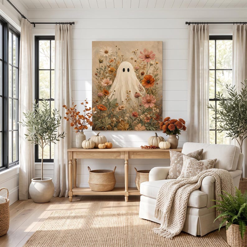 May include: A rectangular wall art print featuring a central white ghost figure surrounded by a dense arrangement of colorful wildflowers in shades of orange, pink, and white, set against a soft, neutral-toned background with a vintage aesthetic.