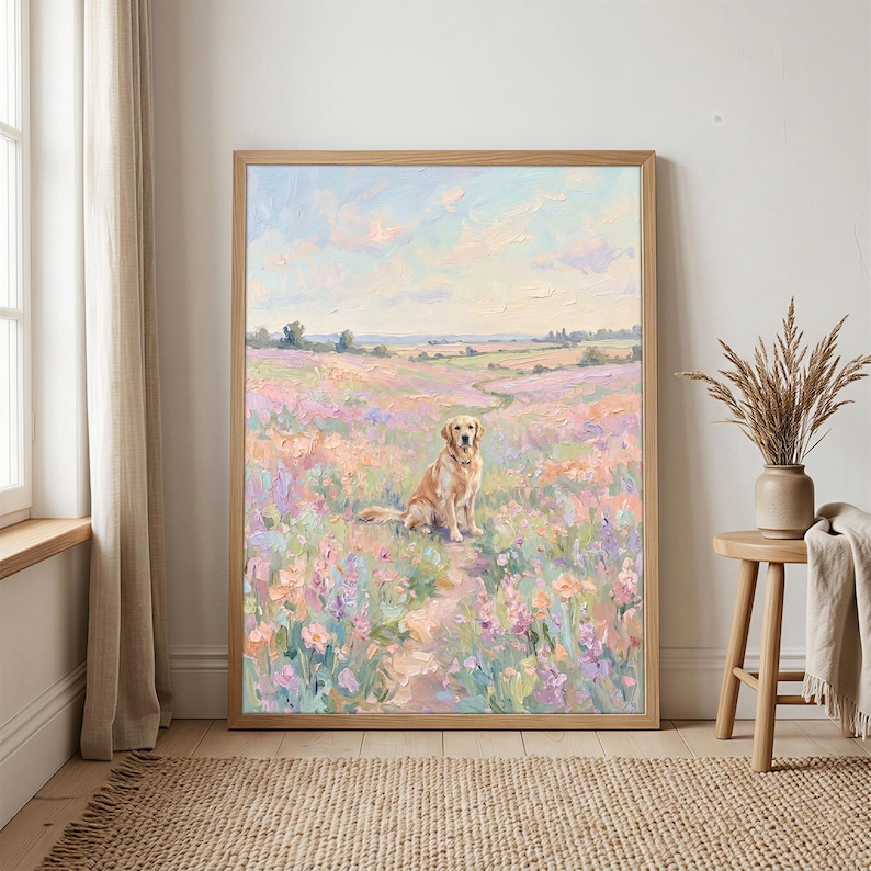 May include: A framed painting of a golden retriever dog sitting in a field of colorful flowers. The artwork features a light brown wooden frame and a pastel color palette of pinks, purples, and blues, evoking a serene, natural scene.