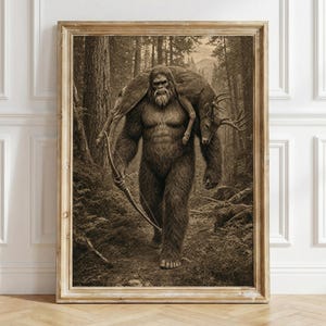 May include: A sepia-toned framed wall art print depicting a large, hairy, bipedal creature resembling a Bigfoot walking through a dense forest. The creature carries a deer across its shoulders and holds a wooden bow in its right hand.