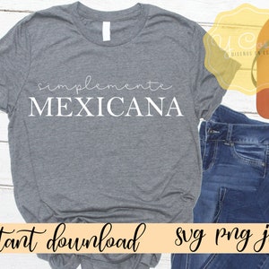 May include: Gray t-shirt with the text "simplemente MEXICANA" in white. The shirt is on a wooden surface with a pair of brown sandals and blue jeans.