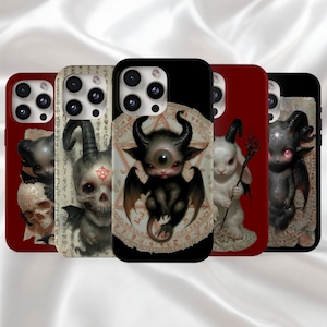 May include: A collection of phone cases featuring gothic-inspired illustrations. The designs include a skull, a one-eyed demon, a white rabbit with a staff, and a dark imp. The cases have a red or black background with intricate details.