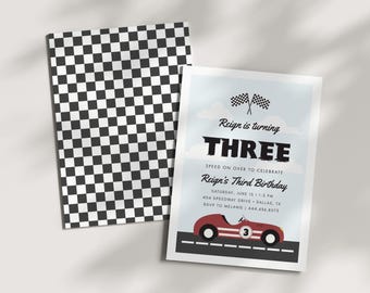 May include: A rectangular birthday invitation card featuring a red race car on a track, checkered flags, and text reading Reign is turning THREE, Speed on over to celebrate, Reign's Third Birthday, Saturday, June 15, 1-3 PM, 404 Speedway Drive, Dallas, TX, RSVP to Melanie, 444.656.8575. The back has a black and white checkered pattern.