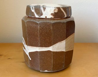 vintage salt fired ceramic lidded jar canister 7” tall rustic earthy boho handmade studio art pottery abstract slip decoration faceted sides