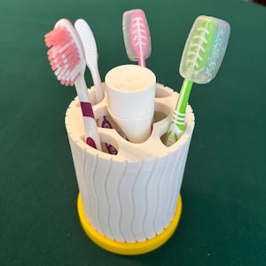 Bathroom toothbrush holder