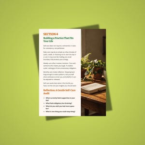 May include: A page from a self-help guide titled "Building a Practice That Fits Your Life." The text is on a white background with a green border. The page includes a section on self-care and a reflection audit. A wooden table with a book and plants is in the background.