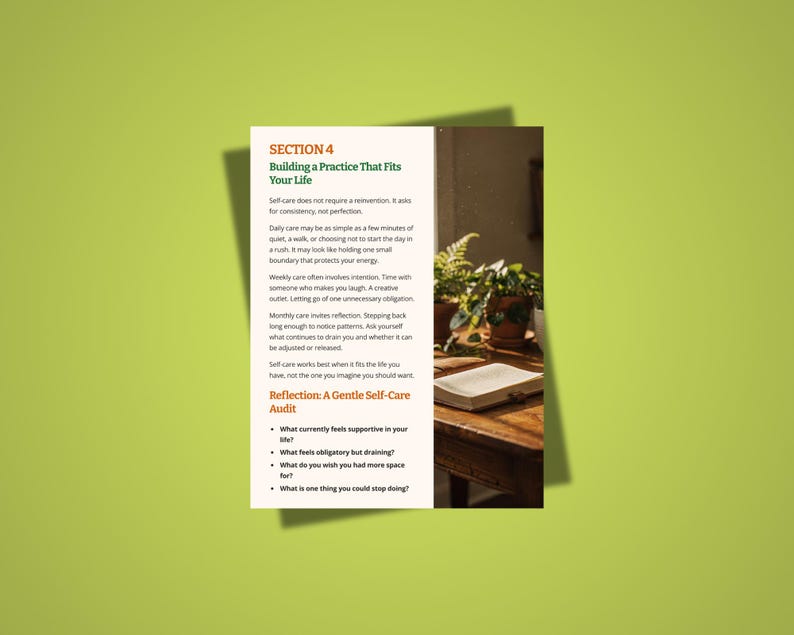 May include: A page from a self-help guide titled "Building a Practice That Fits Your Life." The text is on a white background with a green border. The page includes a section on self-care and a reflection audit. A wooden table with a book and plants is in the background.