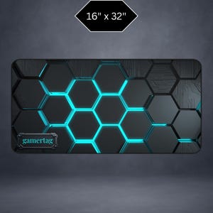 May include: Black gaming mouse pad with a hexagonal pattern and blue neon lighting. The pad measures 16 x 32 inches and features the text "gamertag".